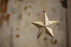 Hanging decorative star ornament against a rustic background in soft light photo