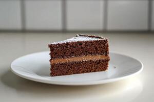 Delicious slice of cake with creamy frosting and a red topping on a plate in natural light photo