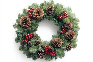 Holiday wreath decorated with pinecones and berries on white background photo