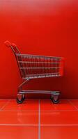 Empty shopping cart against a vibrant red background in a minimalistic setting photo