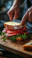 Freshly prepared sandwich stacked with vegetables and grilled chicken on a wooden cutting board photo