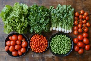 Colorful assortment of fresh vegetables arranged on wooden table photo