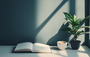 Cozy reading nook with a cup of coffee, an open notebook, and a plant under soft sunlight photo