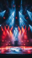Bright stage lights illuminating colorful smoke during a live music performance at night photo