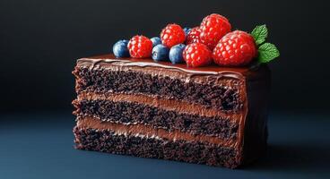 Delicious chocolate cake slice topped with fresh berries ready for dessert photo