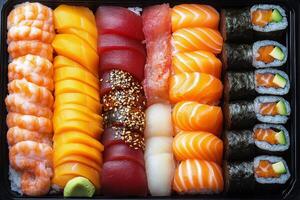 Colorful platter of assorted sushi rolls and sashimi for a special gathering photo
