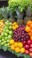 Vibrant display of assorted fruits and vegetables arranged harmoniously on a table photo