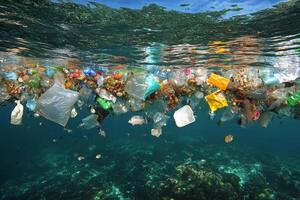 Floating trash bag in calm water reflects environmental concerns about ocean pollution photo