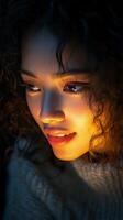 Young woman engaged with smartphone in dimly lit setting at night photo