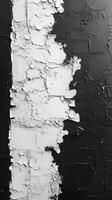 Peeling paint on a wooden surface highlights textures and contrasts in black and white photo