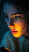 Young woman engaged with smartphone in dimly lit setting at night photo