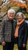 Elderly couple enjoying a sunny day at the park surrounded by nature and vibrant flowers photo