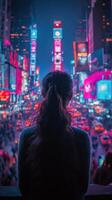 Winter night in Times Square with a person admiring the vibrant lights and snowfall photo