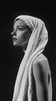 Back view of a person with a towel on head in soft lighting showcasing body form and natural beauty photo