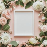 Floral arrangement with blank paper in soft pink hues on neutral background photo