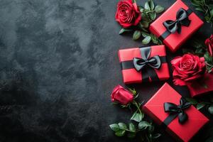 Celebratory red gift boxes with black ribbons arranged on dark background for special occasions photo