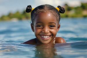 Smiling girl enjoying a swim in clear water on a sunny day photo