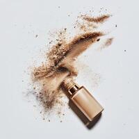 Powder foundation spilled beside its container on a plain background photo
