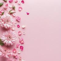 Delicate cherry blossom petals scattered on a soft pink background photo