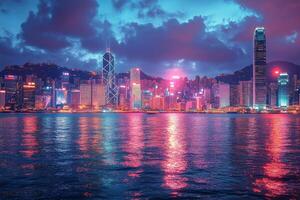 Vibrant skyline of Hong Kong reflected in the harbor at twilight with colorful lights illuminating the buildings photo