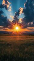 Majestic sunset over mountain landscape with vibrant clouds and sun rays photo