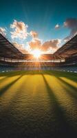 Sunrise illuminating a sports field with shadows and seating in the early morning hours photo