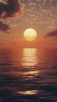 Sunset over the serene ocean creates a breathtaking view with vibrant colors and calm waters photo