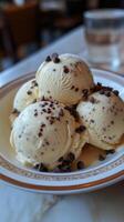 Delicious trio of chocolate chip ice cream served in a stylish bowl at a modern cafe photo