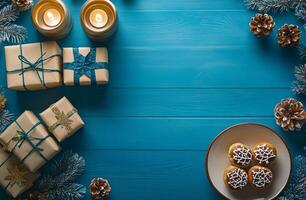 Festive dessert presentation with wrapped bread on blue background surrounded by decorations photo