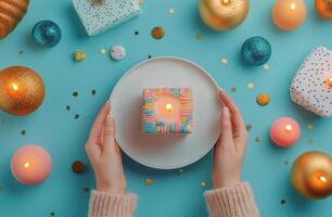 Festive dessert presentation with wrapped bread on blue background surrounded by decorations photo