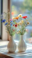 Fresh flowers in blue glass vases capture sunlight in a tranquil indoor setting photo