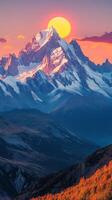 Majestic mountain landscape at sunrise with golden light illuminating the valley below photo