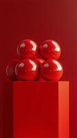 Abstract composition of red spheres on a pedestal in a studio setting photo