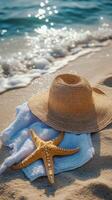 Relaxing beach essentials on warm sand with gentle waves at a tropical location photo