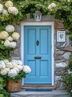 Charming blue door surrounded by white daisies and a wicker basket in a serene garden setting photo