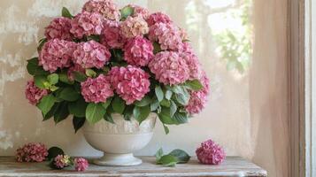 Beautiful pink hydrangeas in a decorative vase on a rustic wooden table by a bright window photo