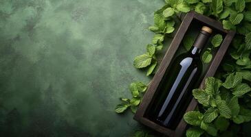 Bottles of oil nestled among fresh mint leaves on a textured green background photo