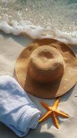 Relaxing beach essentials on warm sand with gentle waves at a tropical location photo