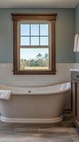 Elegant bathroom with a freestanding tub and scenic window view in a serene setting photo