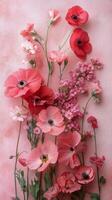 Bright pink floral arrangement showcasing various blooms in a soft pink background setting photo