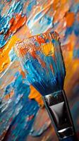Vibrant brush resting on colorful paint palette showcasing artistic creativity and texture photo