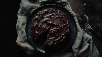 Rich chocolate cake decorated with creamy frosting on a rustic wooden table photo