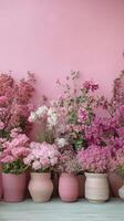 Bright pink floral arrangement showcasing various blooms in a soft pink background setting photo