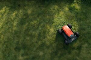 Lawn mower resting in a lush green field under soft morning light photo