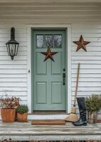Charming front door with rustic decor and seasonal accents in a countryside setting photo