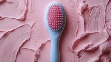 Innovative pink facial cleansing brush designed for gentle skincare routines photo