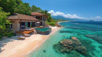 Breathtaking tropical beach with clear turquoise water and seaside villa in the Caribbean photo