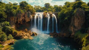 Majestic waterfall cascading over cliffs in a misty landscape at dawn photo