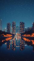 Stunning city skyline illuminated at night reflecting on water surface in urban area photo