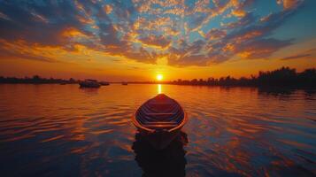 Sunset reflections over tranquil water with a silhouette of a boat near the horizon photo